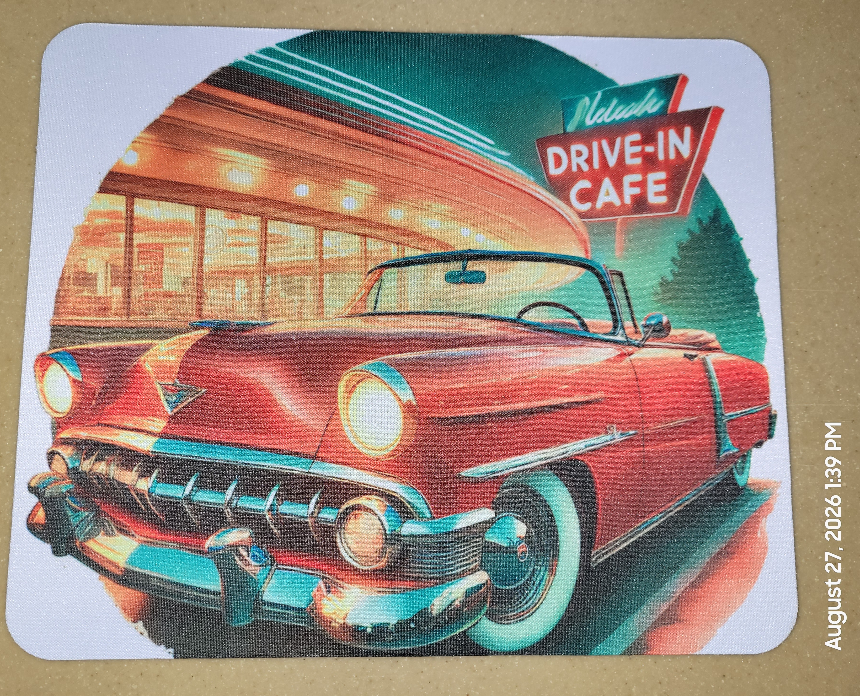 Mouse pad with a colorful vintage car at a drive-in cafe