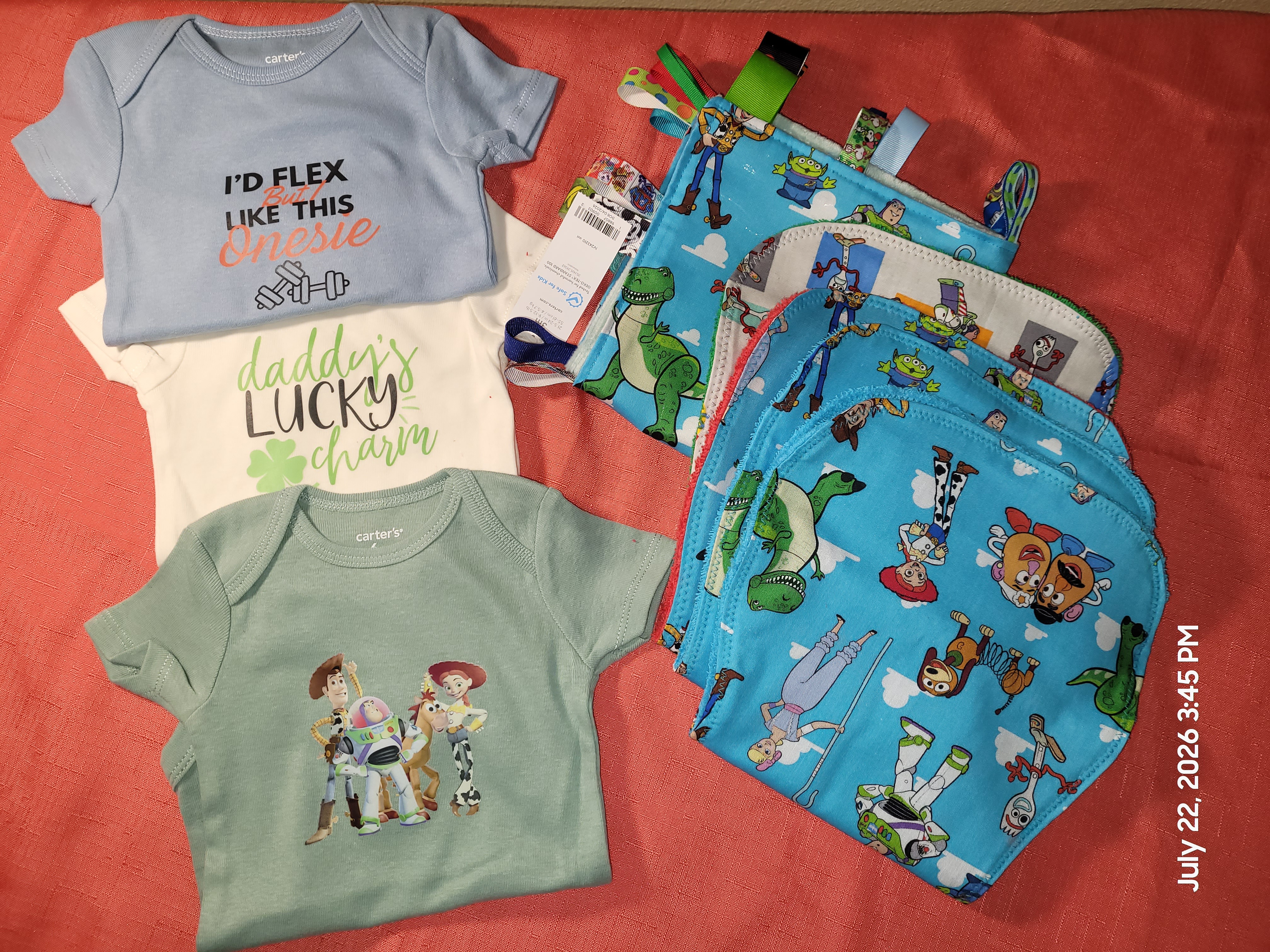 Three personalized onesies with coordinated handmade baby accessories